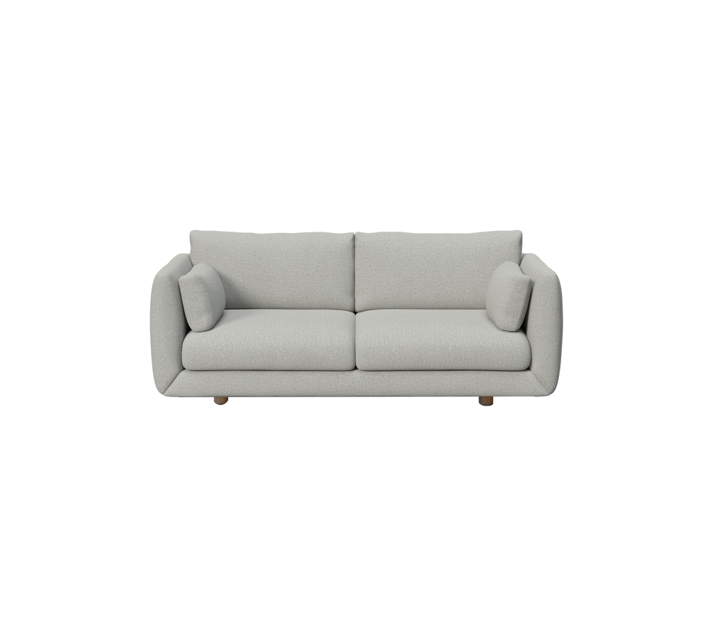 Ljusgrå modern soffa med runda kuddar i en minimalistisk design.