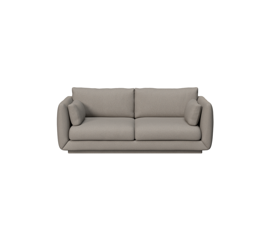 Ljusbrun modern soffa med mjuka kuddar.