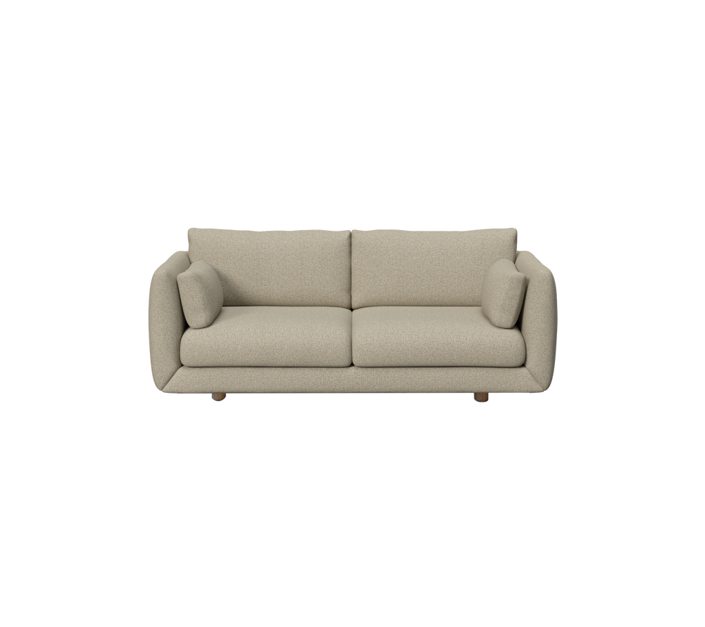 Modern brun soffa med rundade kuddar i en loungeinställning.