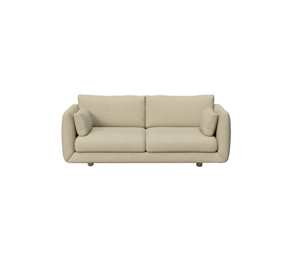 Ljusbrun modern soffa med rundade armstöd och kuddar.