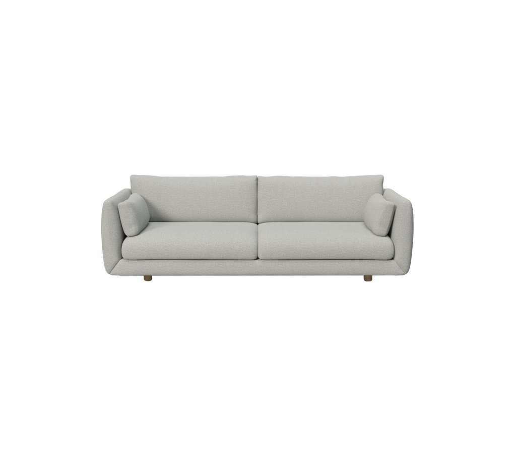 Ljusgrå modern soffa med runda kuddar.