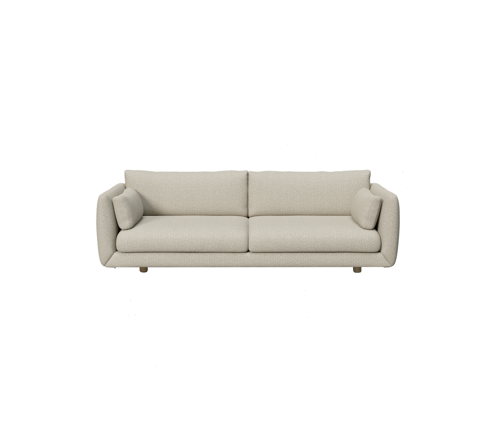 Modern ljusbrun soffa med rundade kuddar i en minimalistisk design.