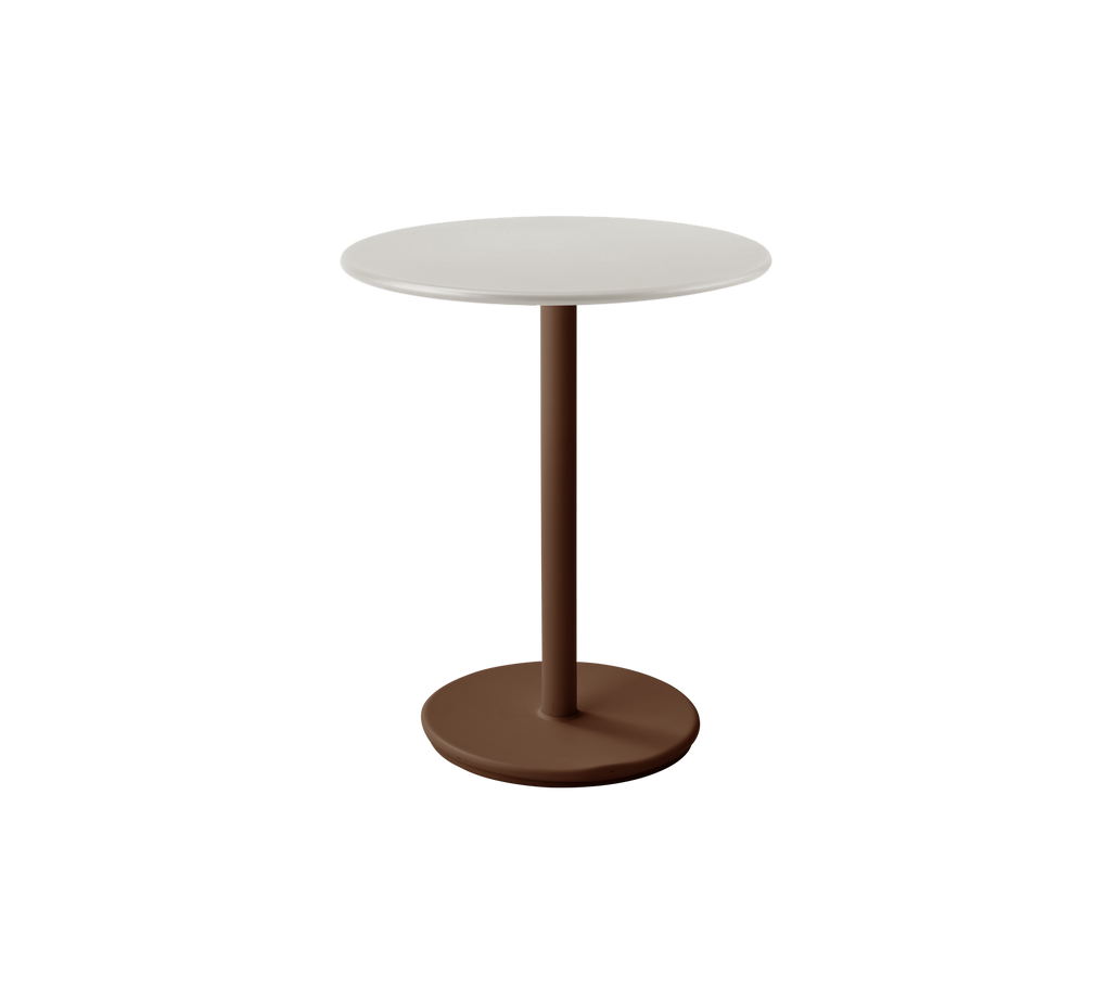 Modernt vitt bord med ökenröd bas i en stilfull loungeinställning.