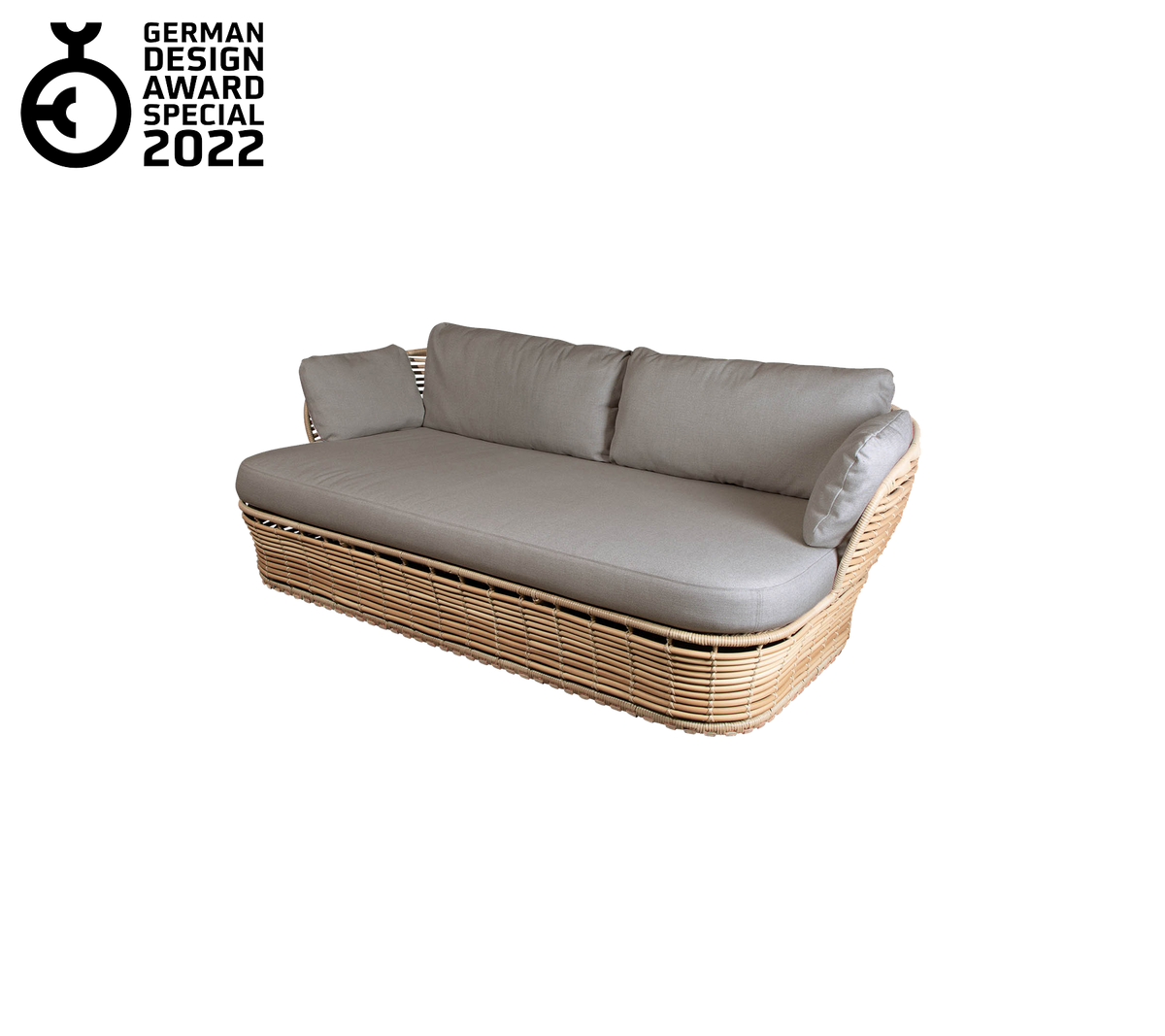Nutida soffa med vävd bas och mjuka grå kuddar, med en slank design och elegant estetik. Tilldelad 2022.