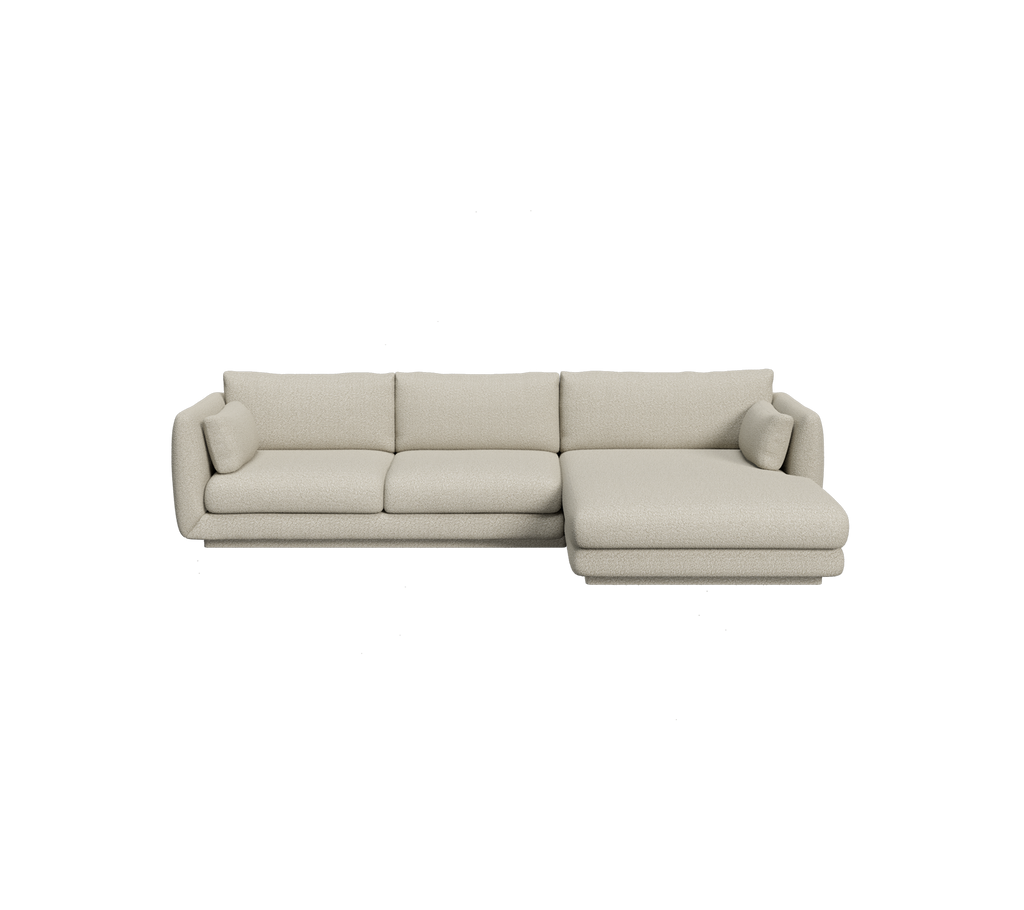 Ljusbrun sektionell soffa med minimalistisk design.