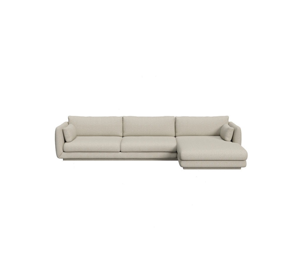 Ljusbrun sektion-soffa i en modern lounge-miljö.