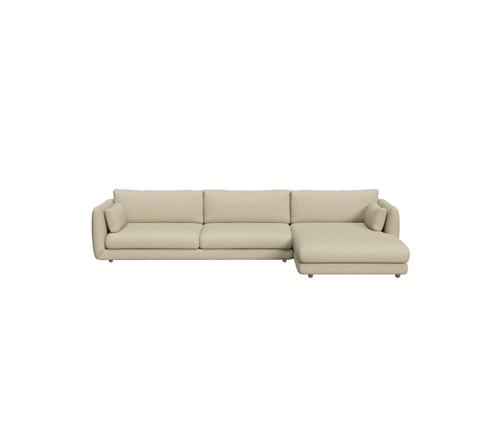 Ljusbrun modern sektionell soffa i en samtida loungeinställning.