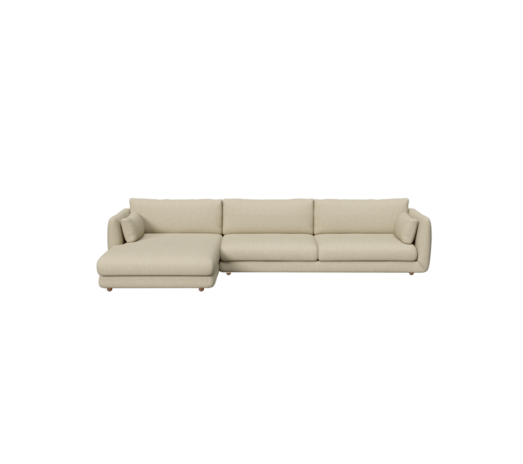 Ljusbrun modern soffa med en chaiselongdel i en loungeinställning.