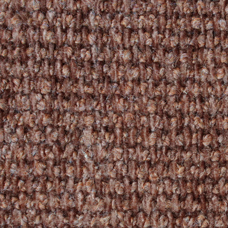 Närbild av ett texturerat brunt tyg.